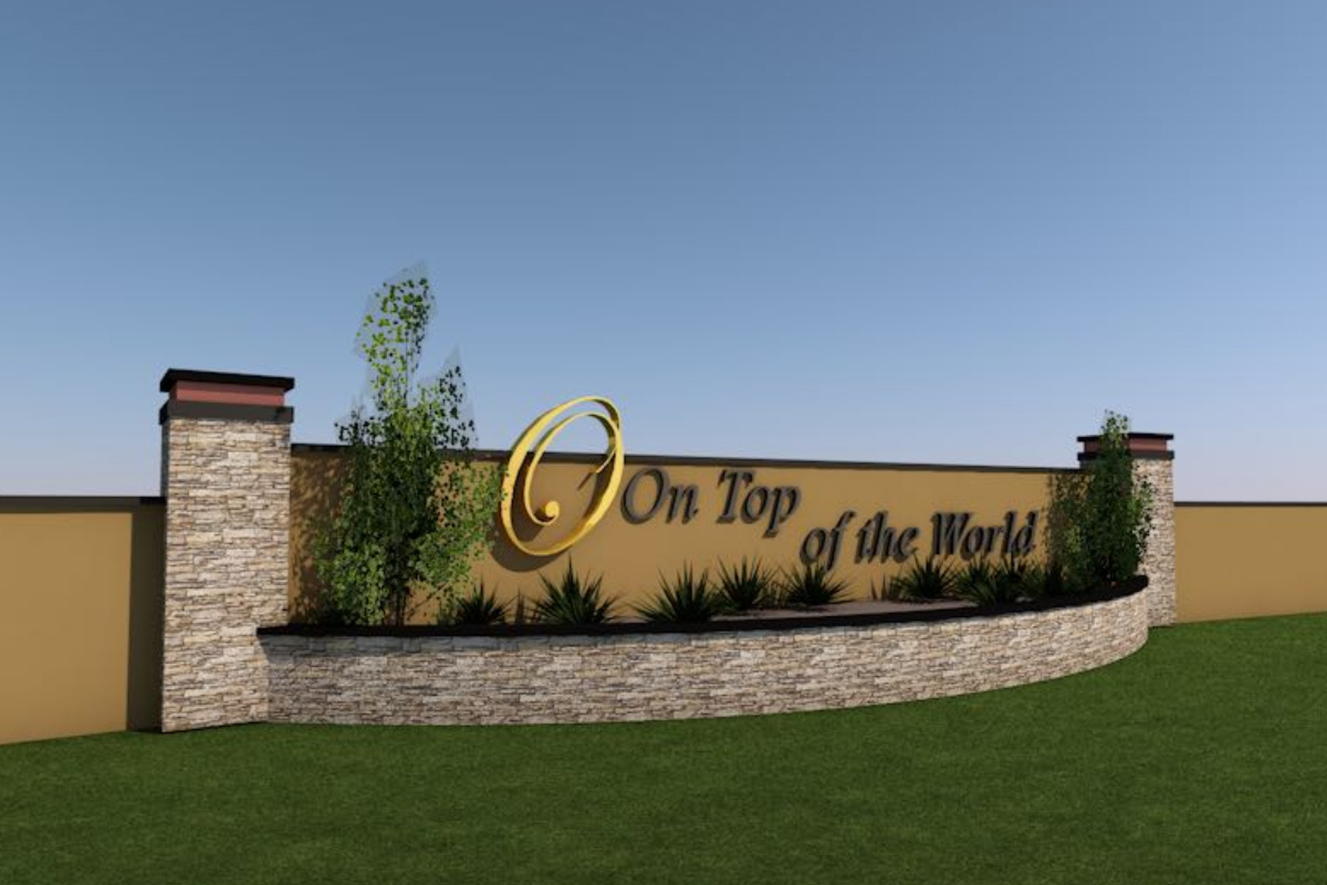 Image of commercial residential entry sign with grey brick and name of development