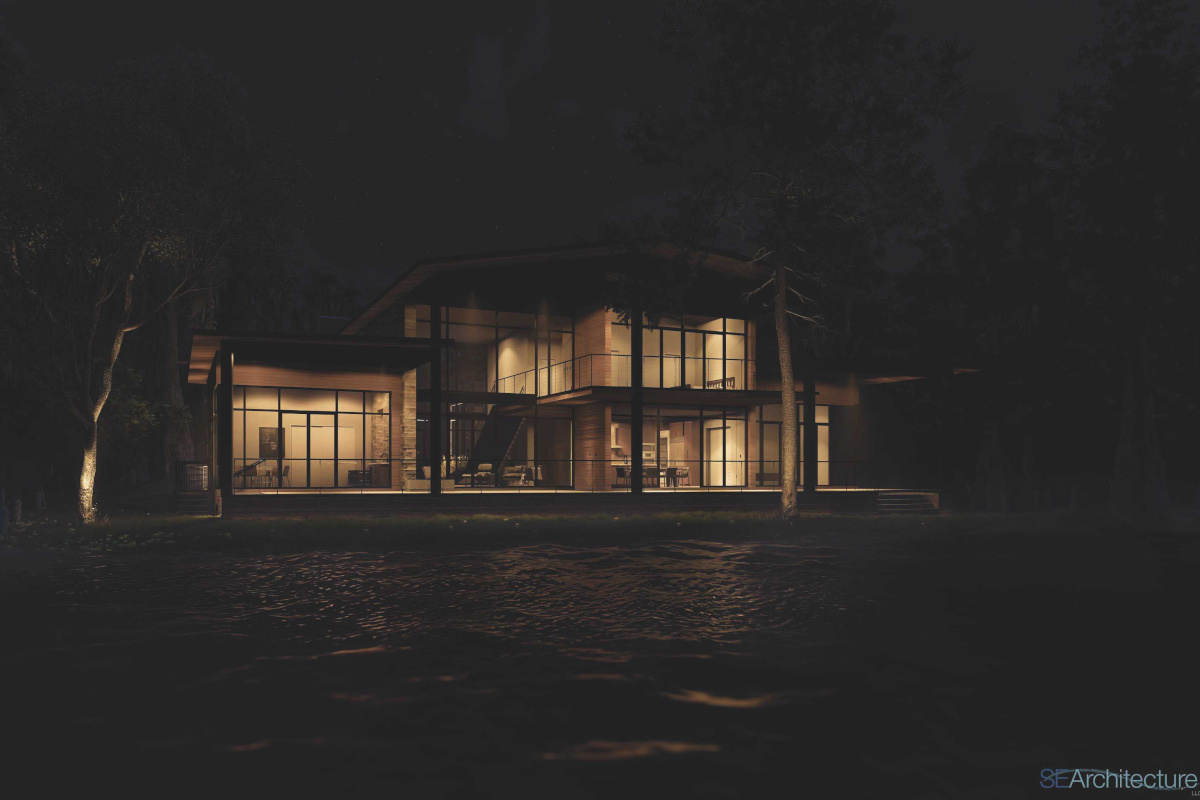 Image of modern home exterior at night with ambient lighting reflecting off lake water