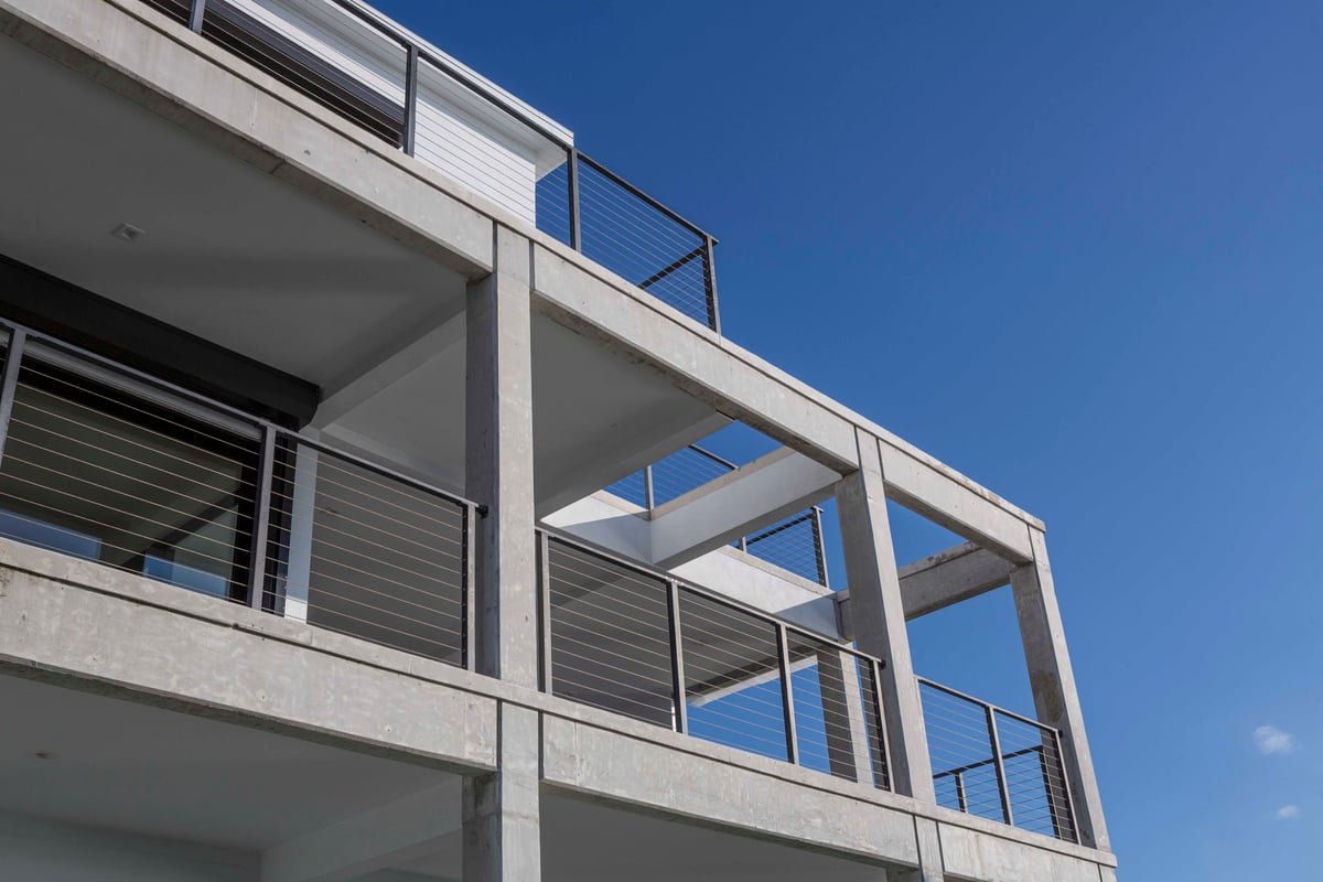 Image of concrete balconies that are two stories
