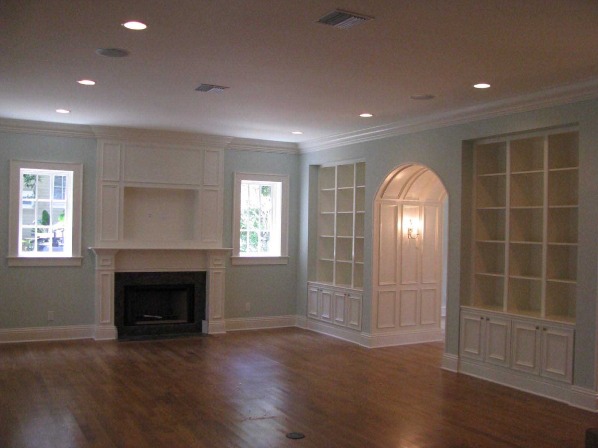 South Tampa Colonial Home - View of family room with built-in bookcases and fireplace